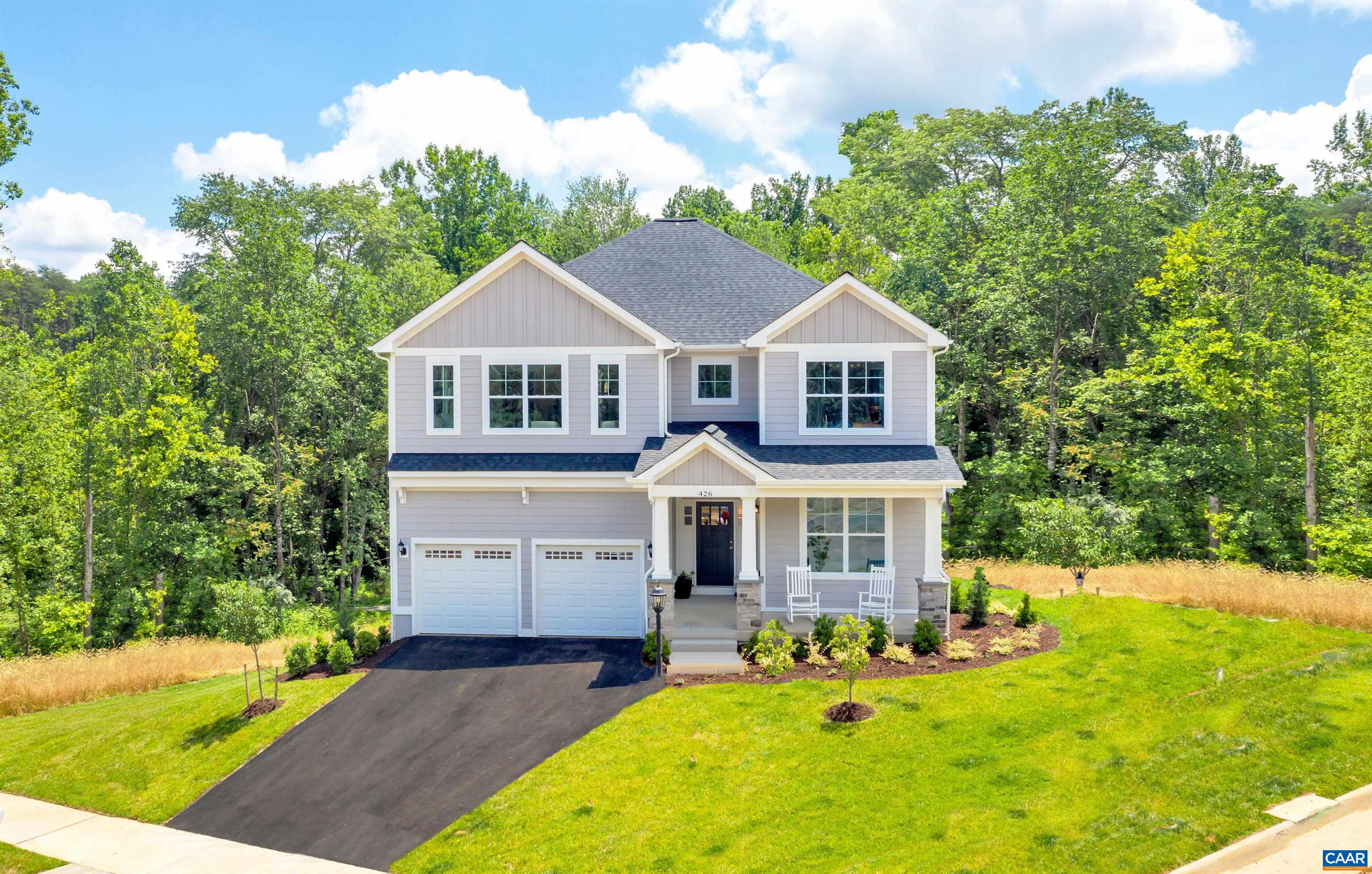 front view of a house with a yard