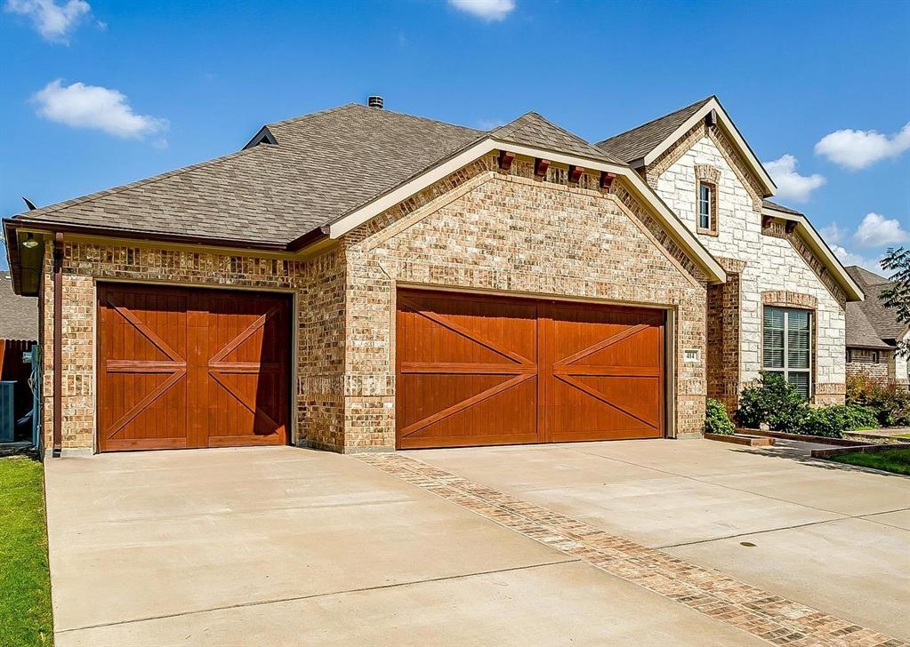 a front view of a house with a garage