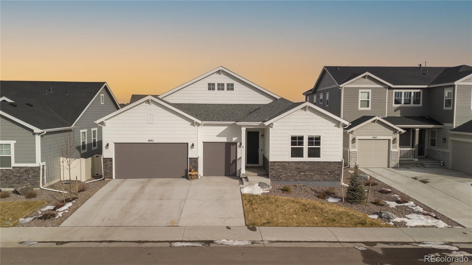 a front view of a house with garage