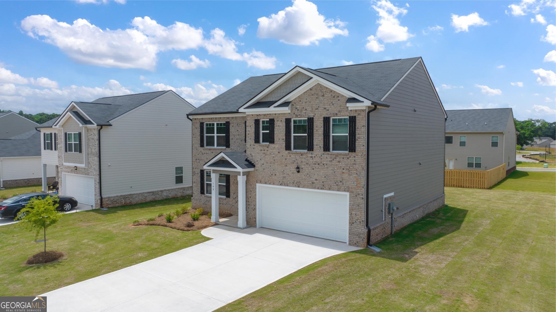 a front view of a house with a yard