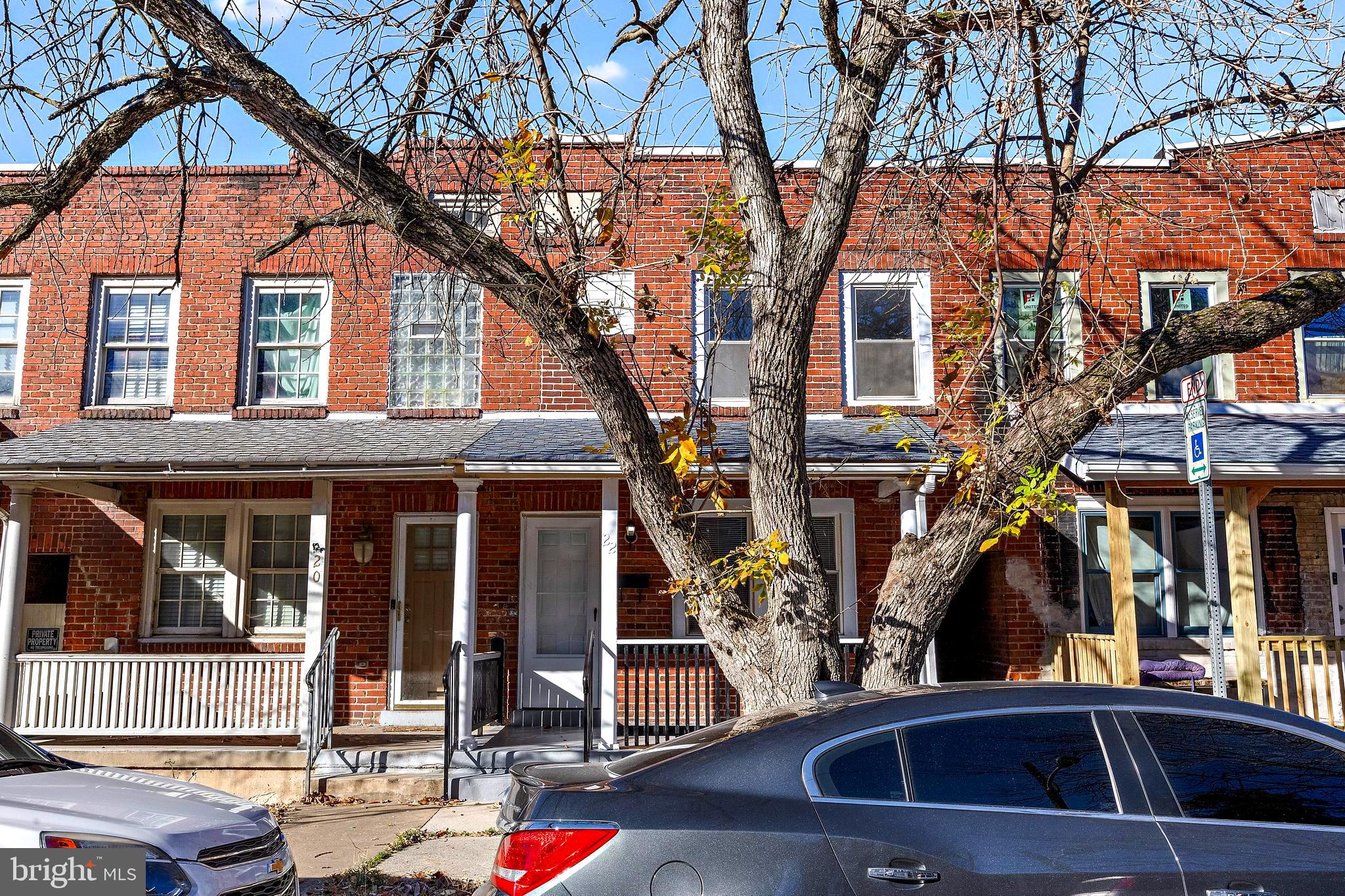 a view of a brick house with large windows