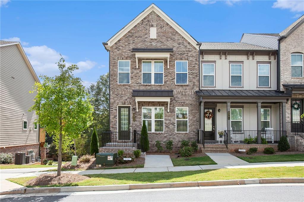 a front view of a house with a yard