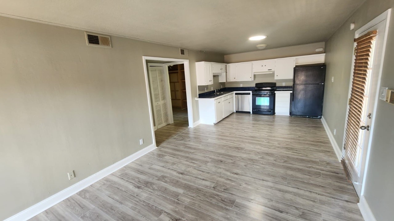 a view of kitchen with wooden floor