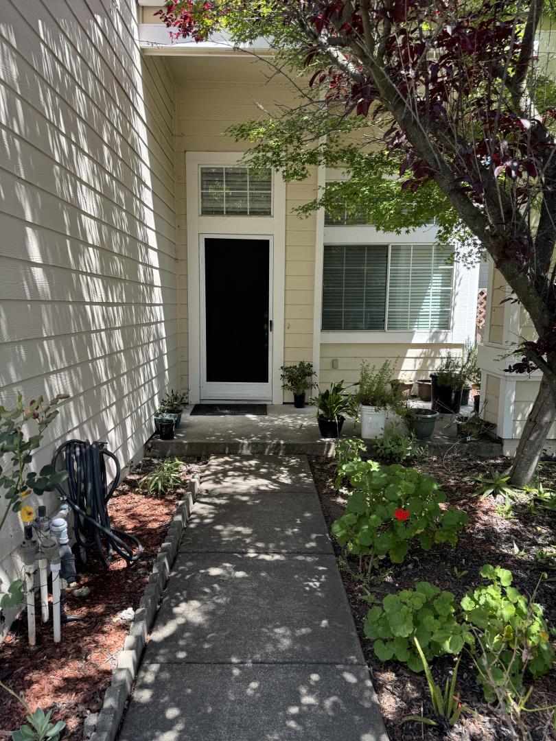 a front view of a house with garden