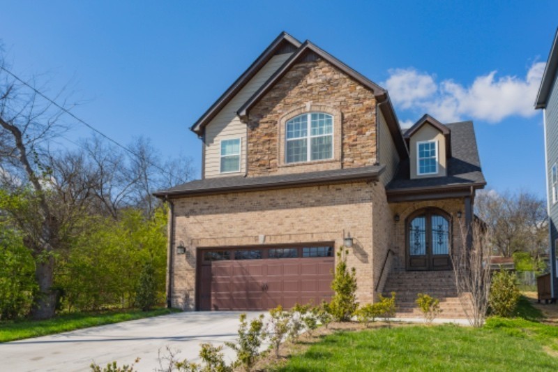 a front view of a house with yard