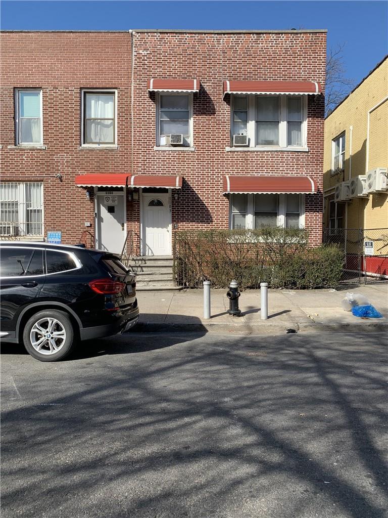 a front view of a house with parking space