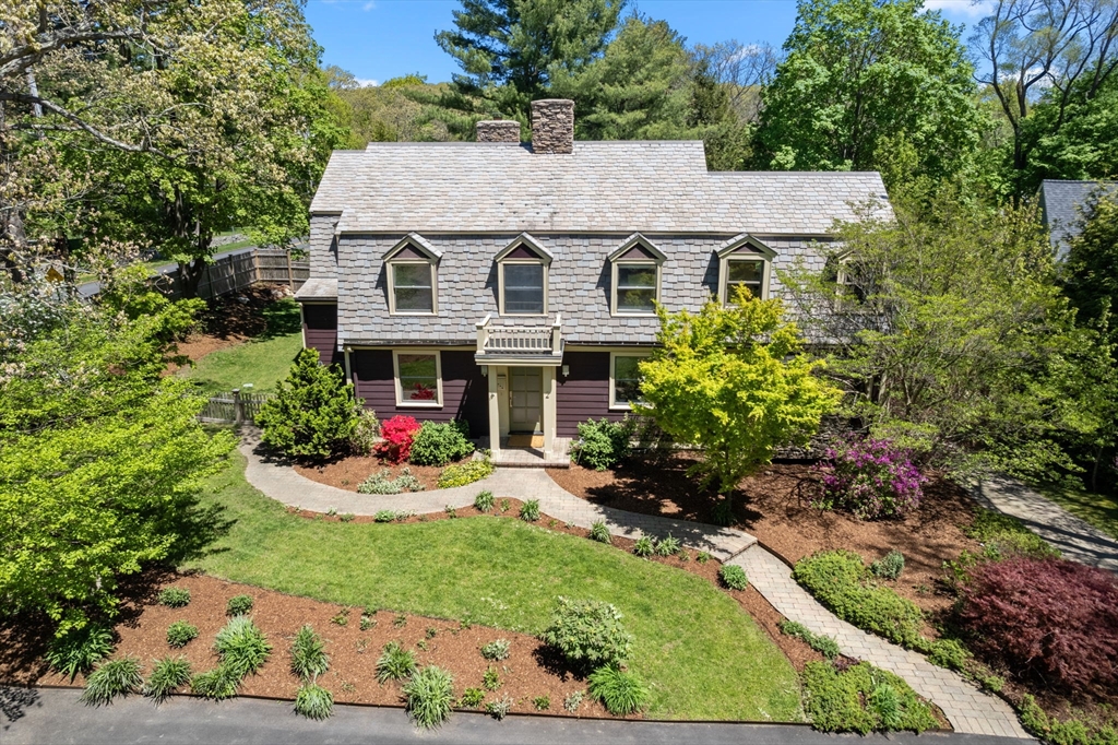 a view of a house with garden and yard