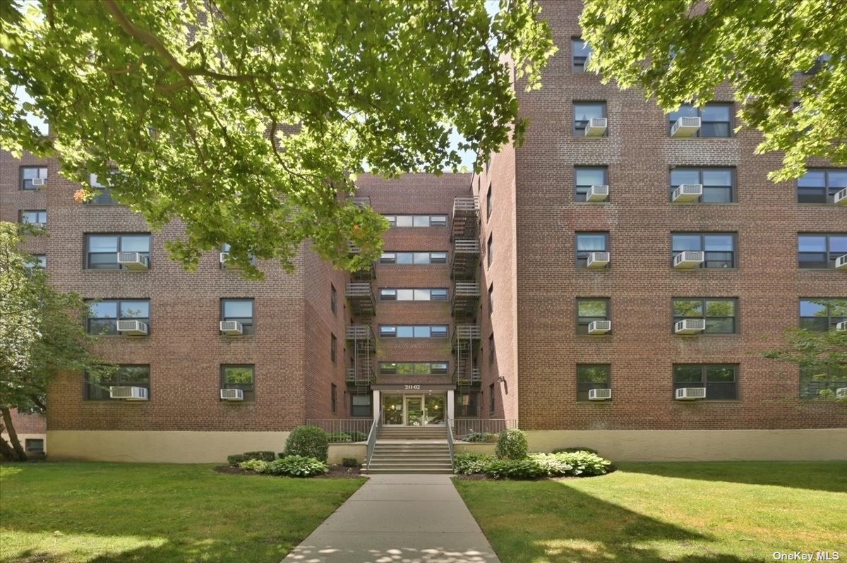 front view of a building with a yard