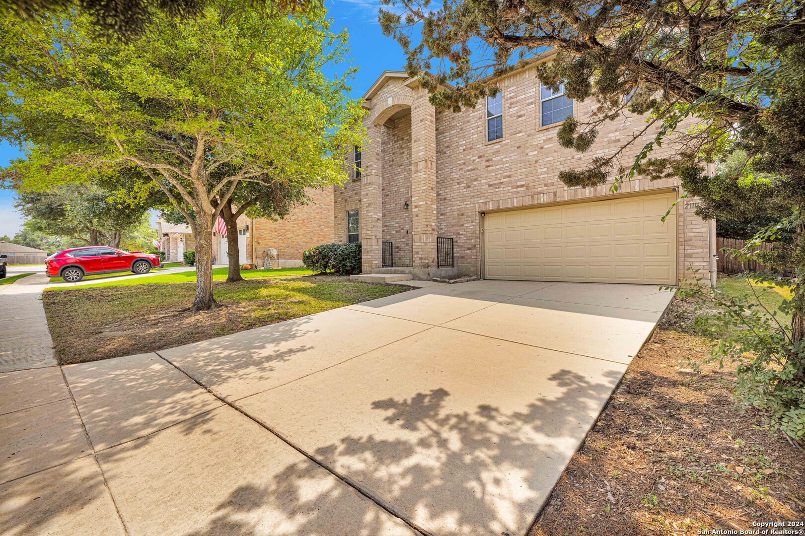 a front view of a house with a yard