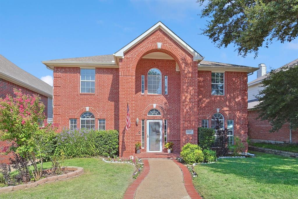 front view of a house with a yard