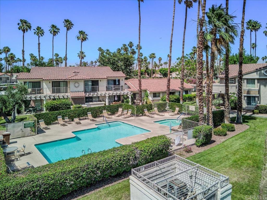 a view of a house with garden and a patio