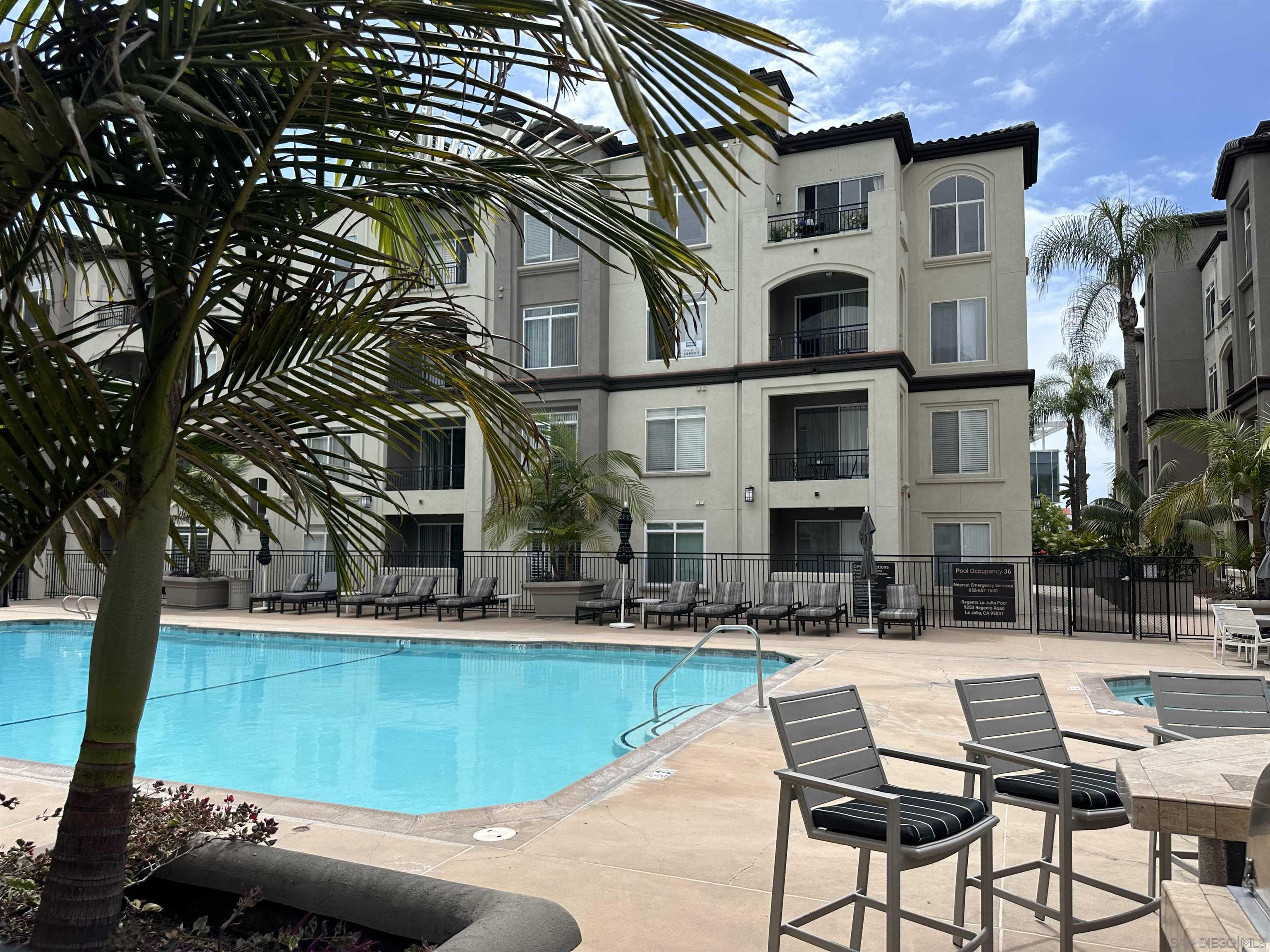 a view of pool with outdoor seating