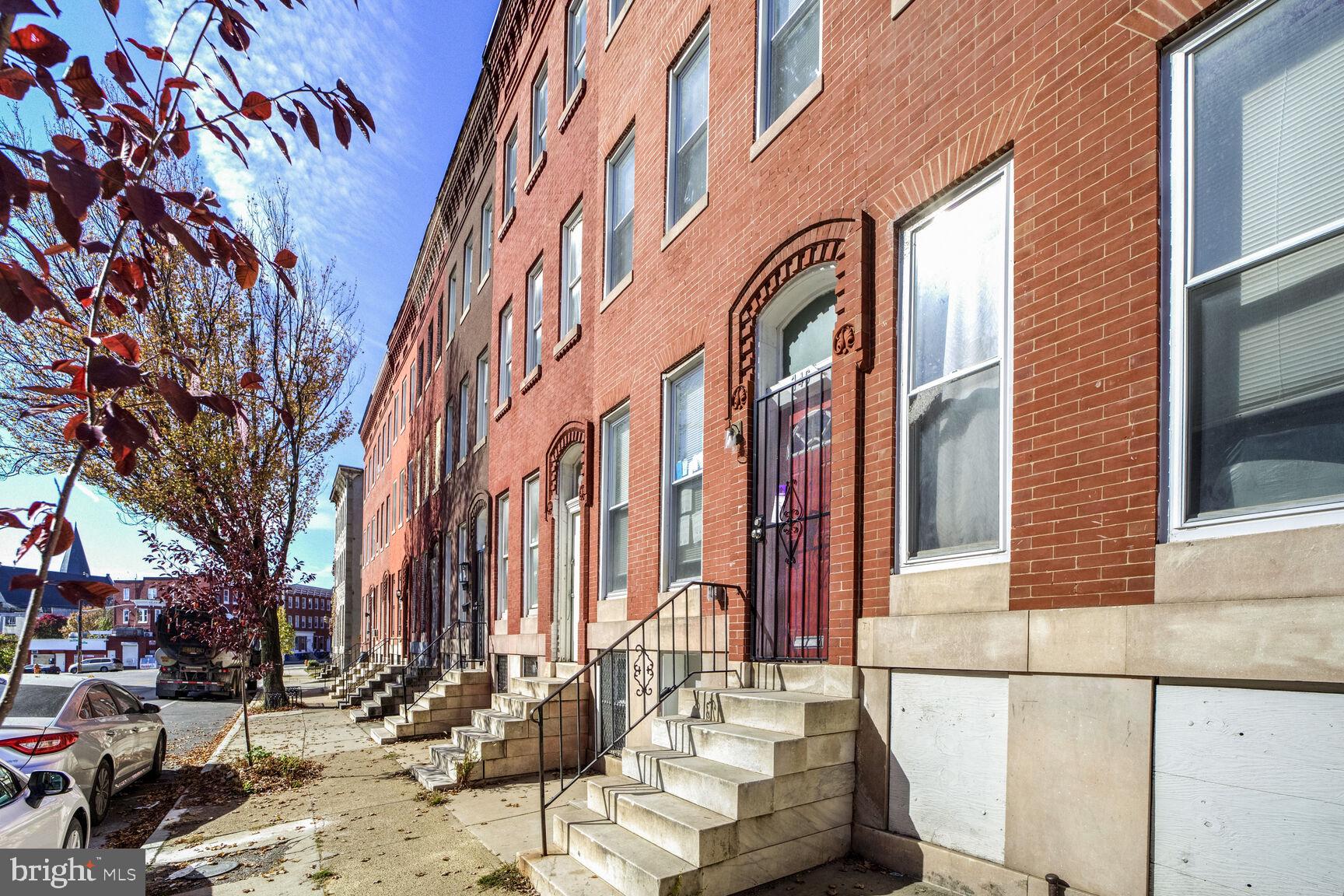 a view of a building with a yard