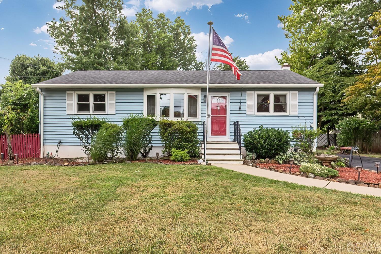 a view of a house with a yard and plants