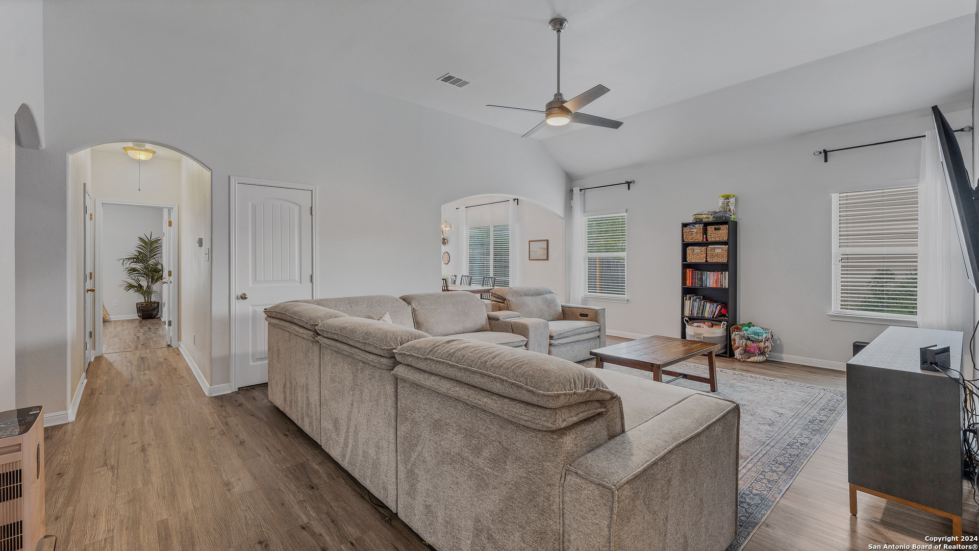 a living room with furniture and a large window