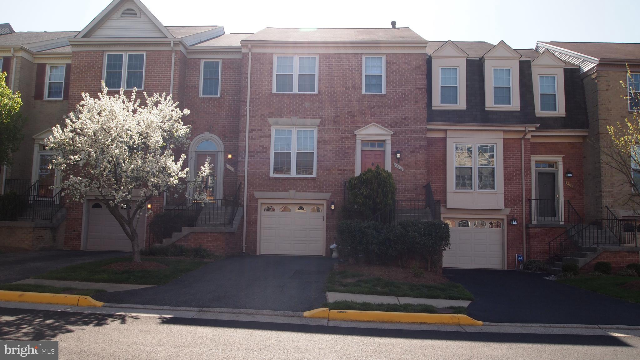 a front view of a house with yard