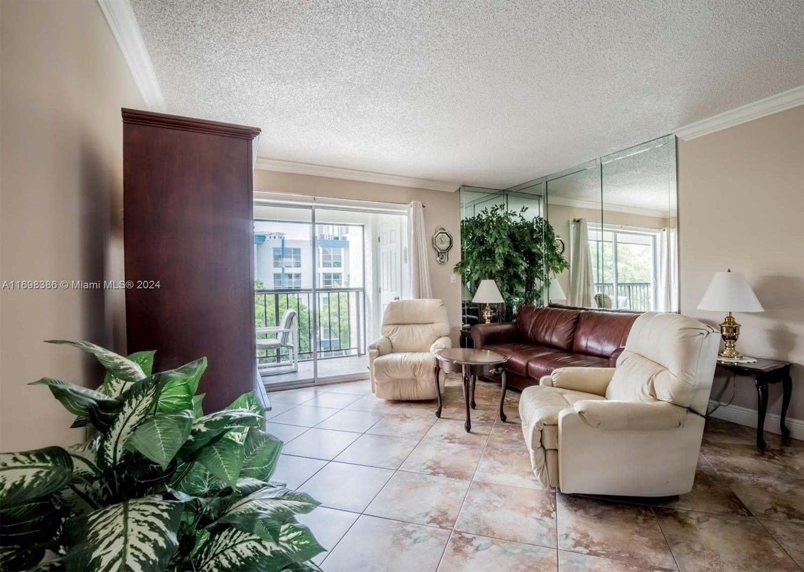 a living room with furniture potted plant and a window