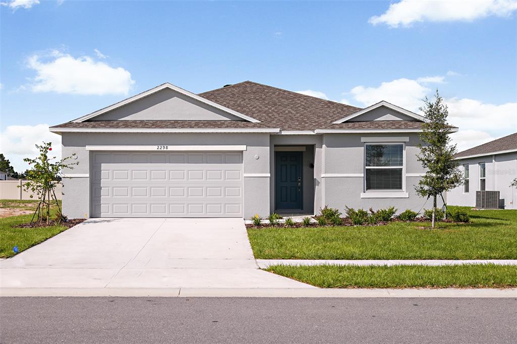 front view of a house with a yard