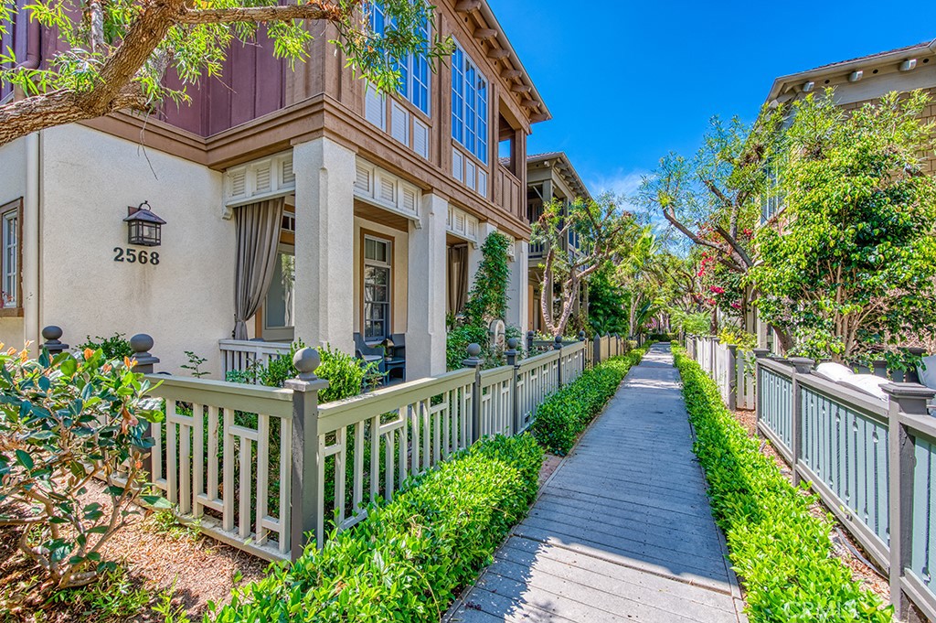 a view of a house with wooden fence