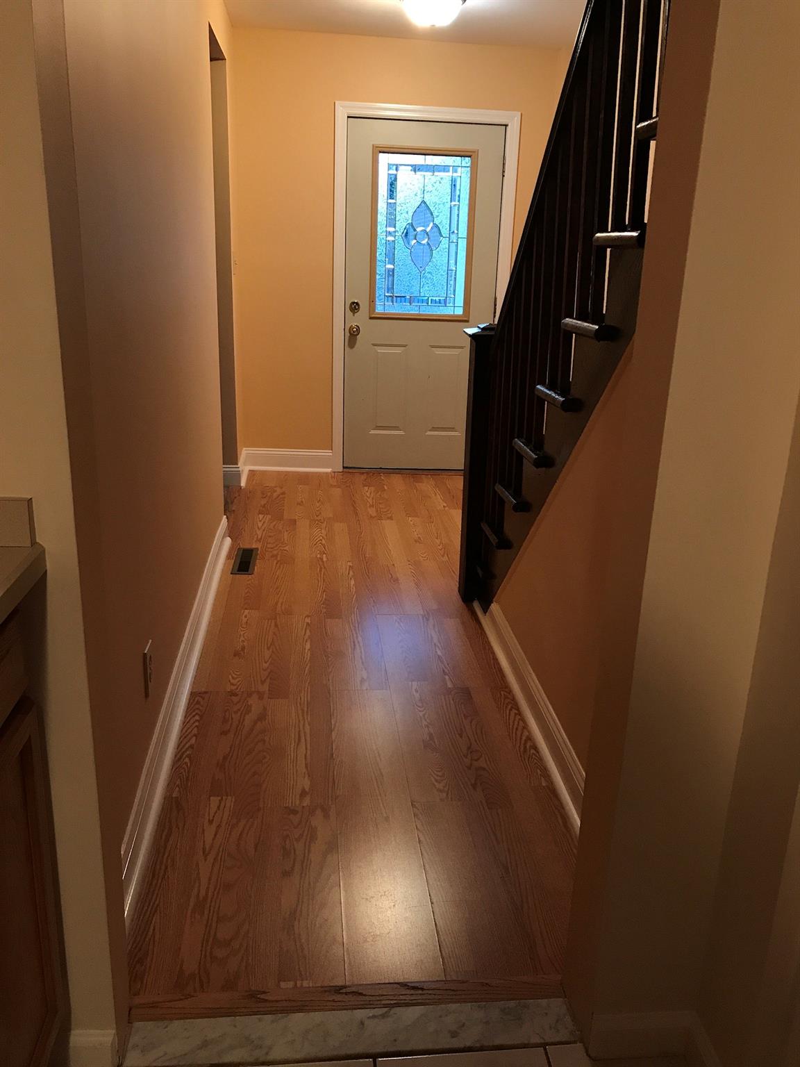 Doorway to outside with light wood-type flooring