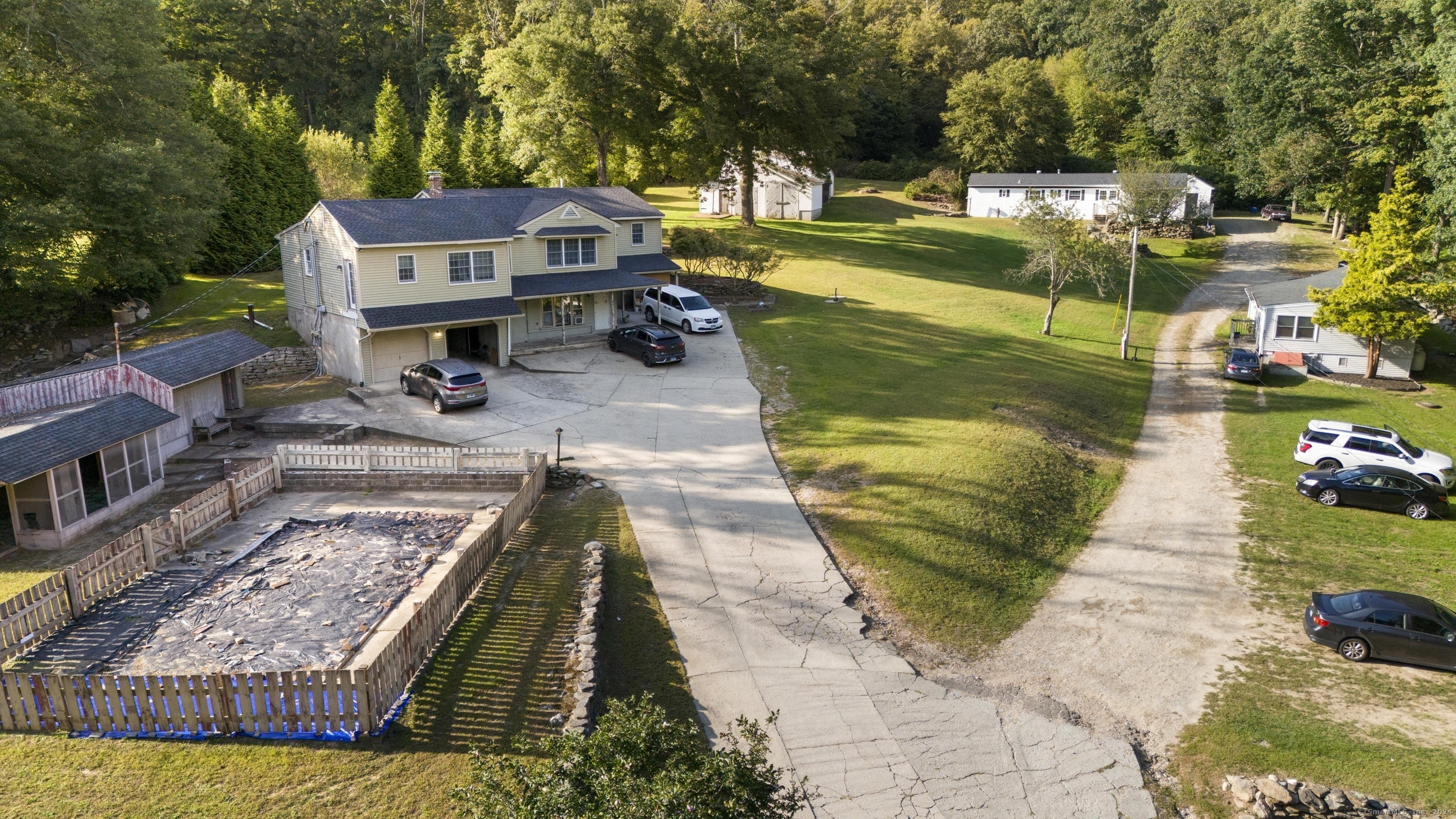 a view of a lake with couches in front of house