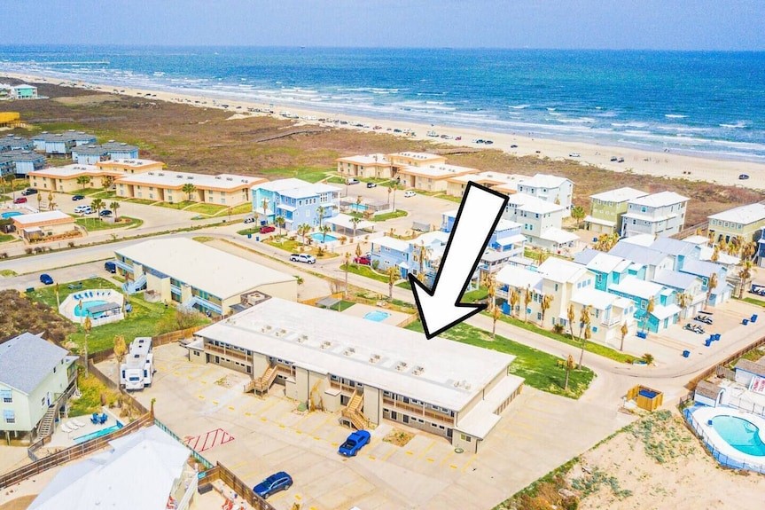 a view of a swimming pool with an ocean view