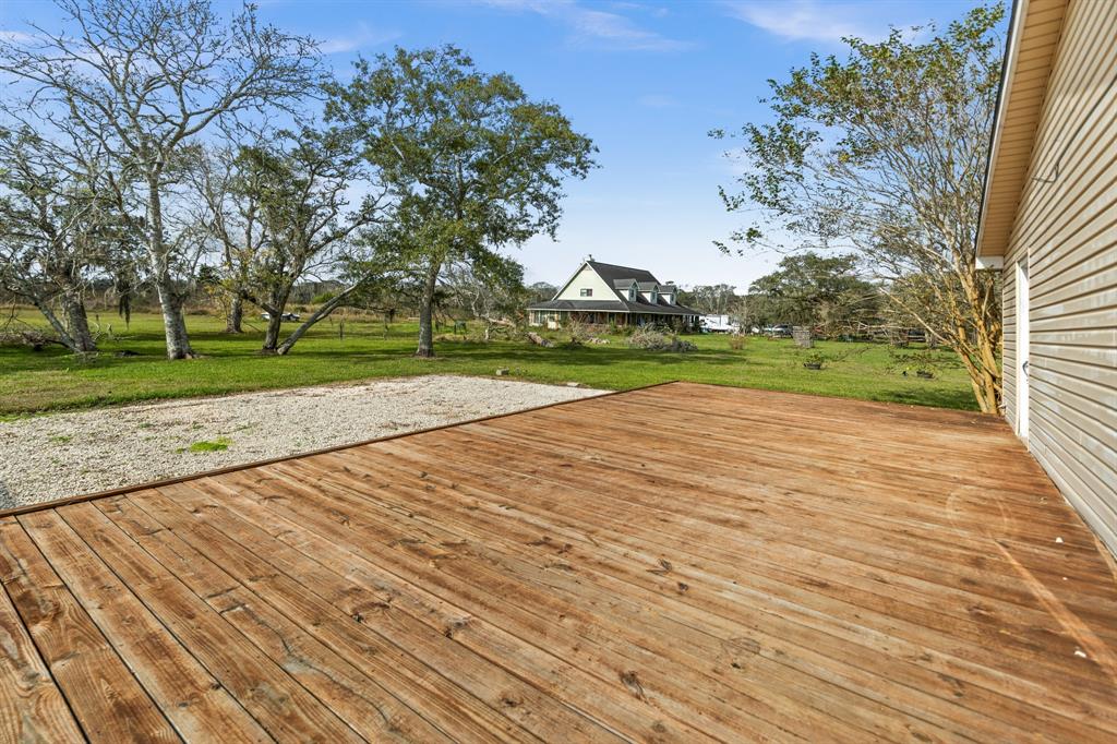 a view of empty space with wooden fence