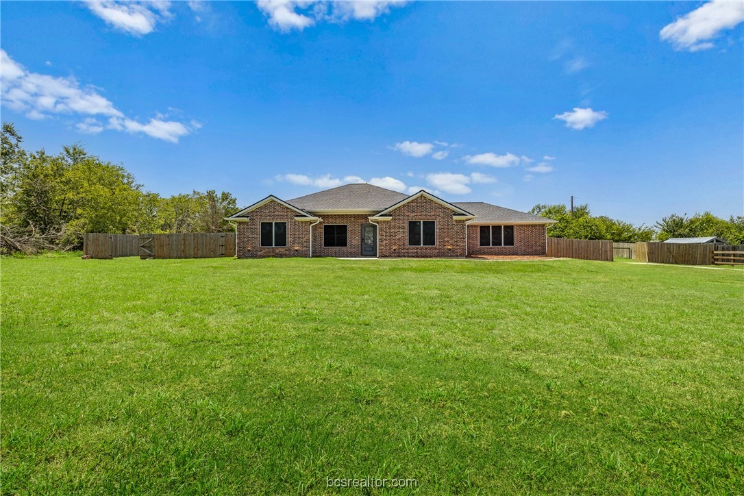 a view of a house with a big yard