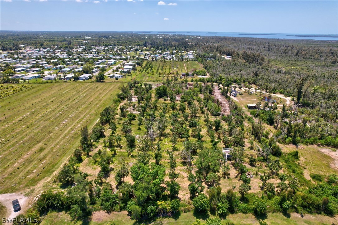 an aerial view of residential building and lake