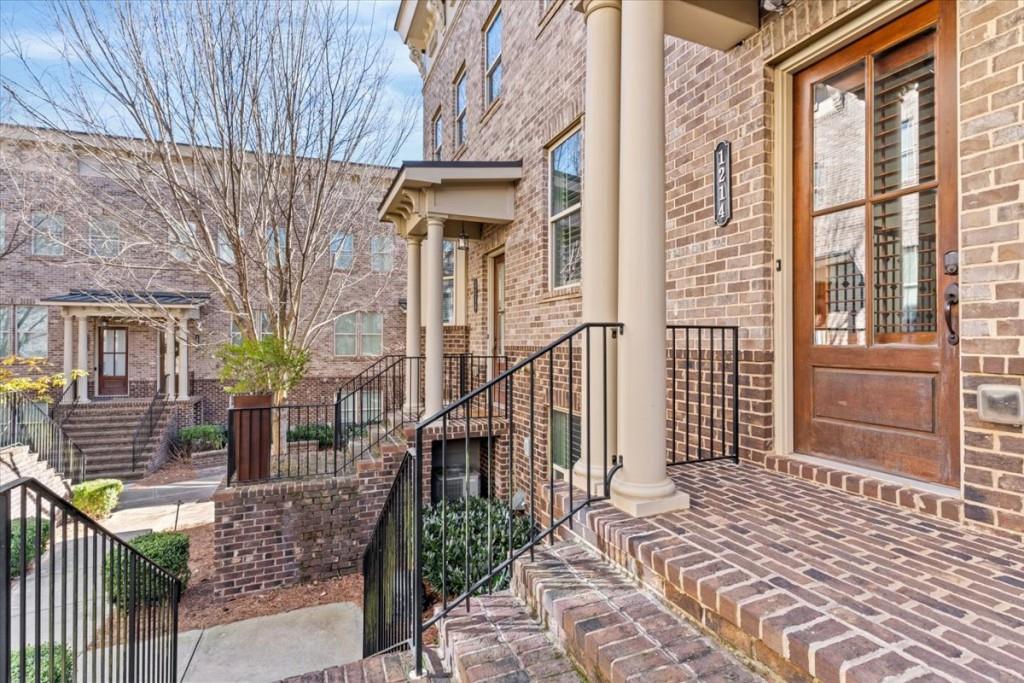 a view of a brick house with many windows