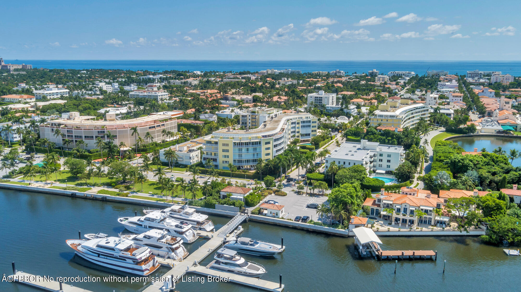 an aerial view of lake and residential houses with outdoor space