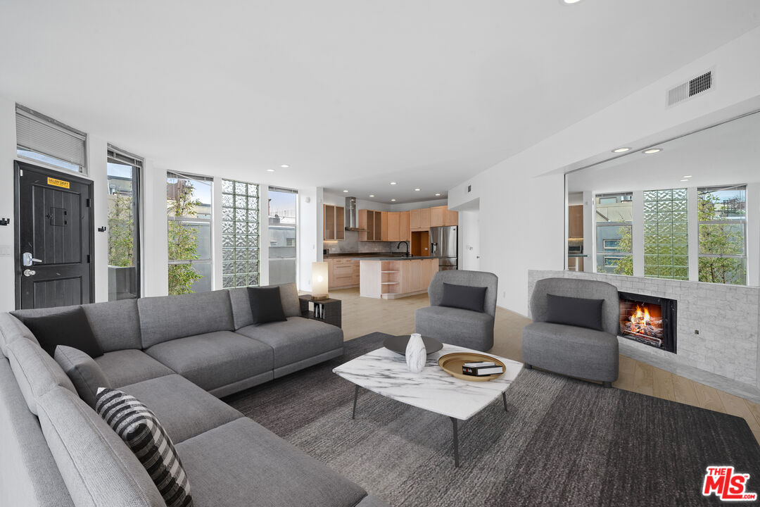 a living room with furniture and a large window