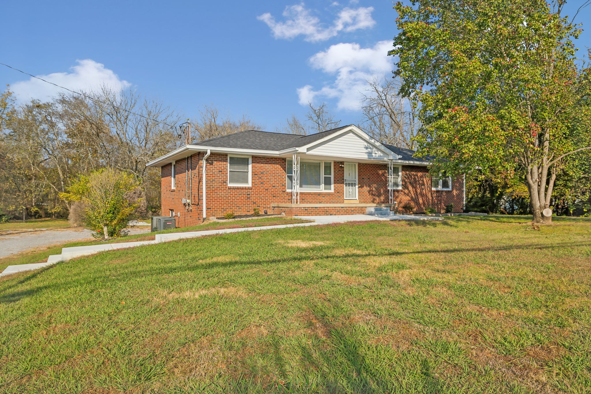 a front view of a house with a yard