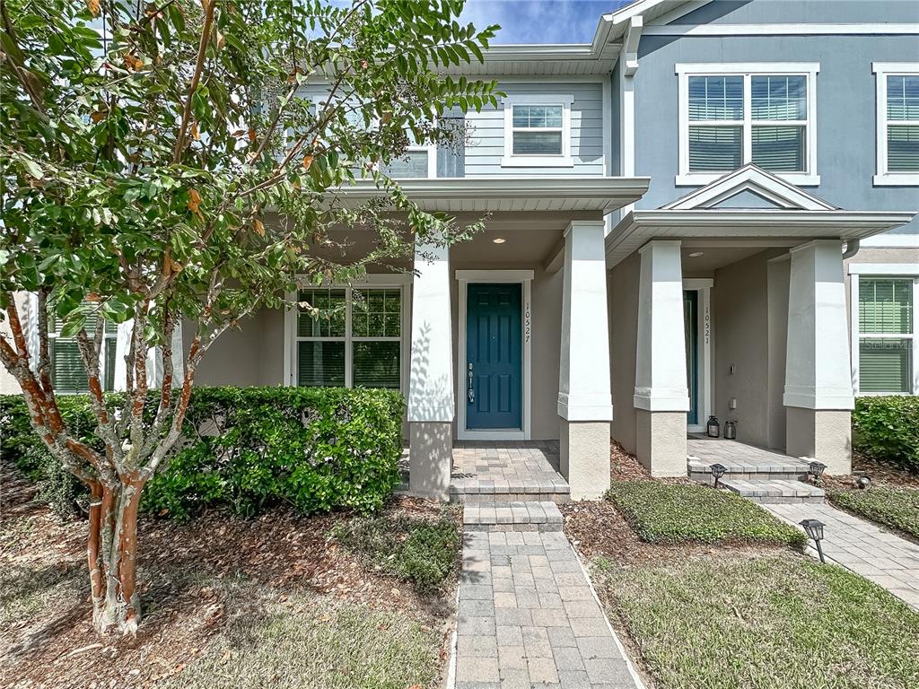 a front view of a house with garden