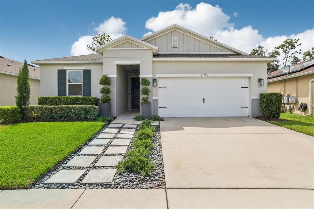 front view of a house with a yard