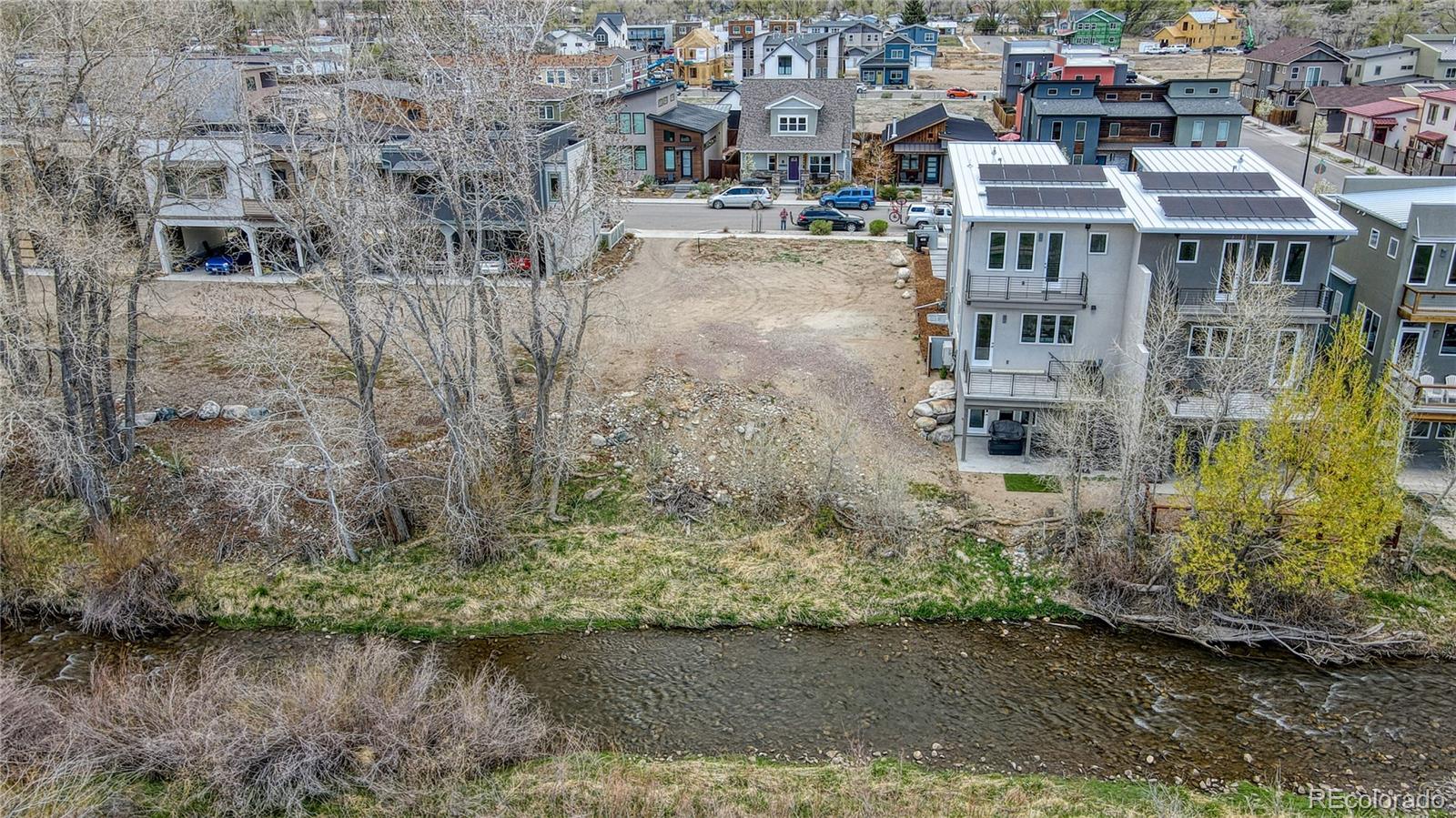 a view of multiple houses with a lake view