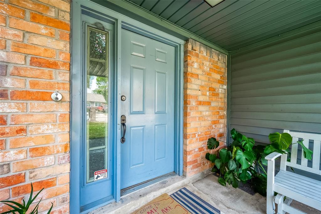 a view of a door and wooden floor