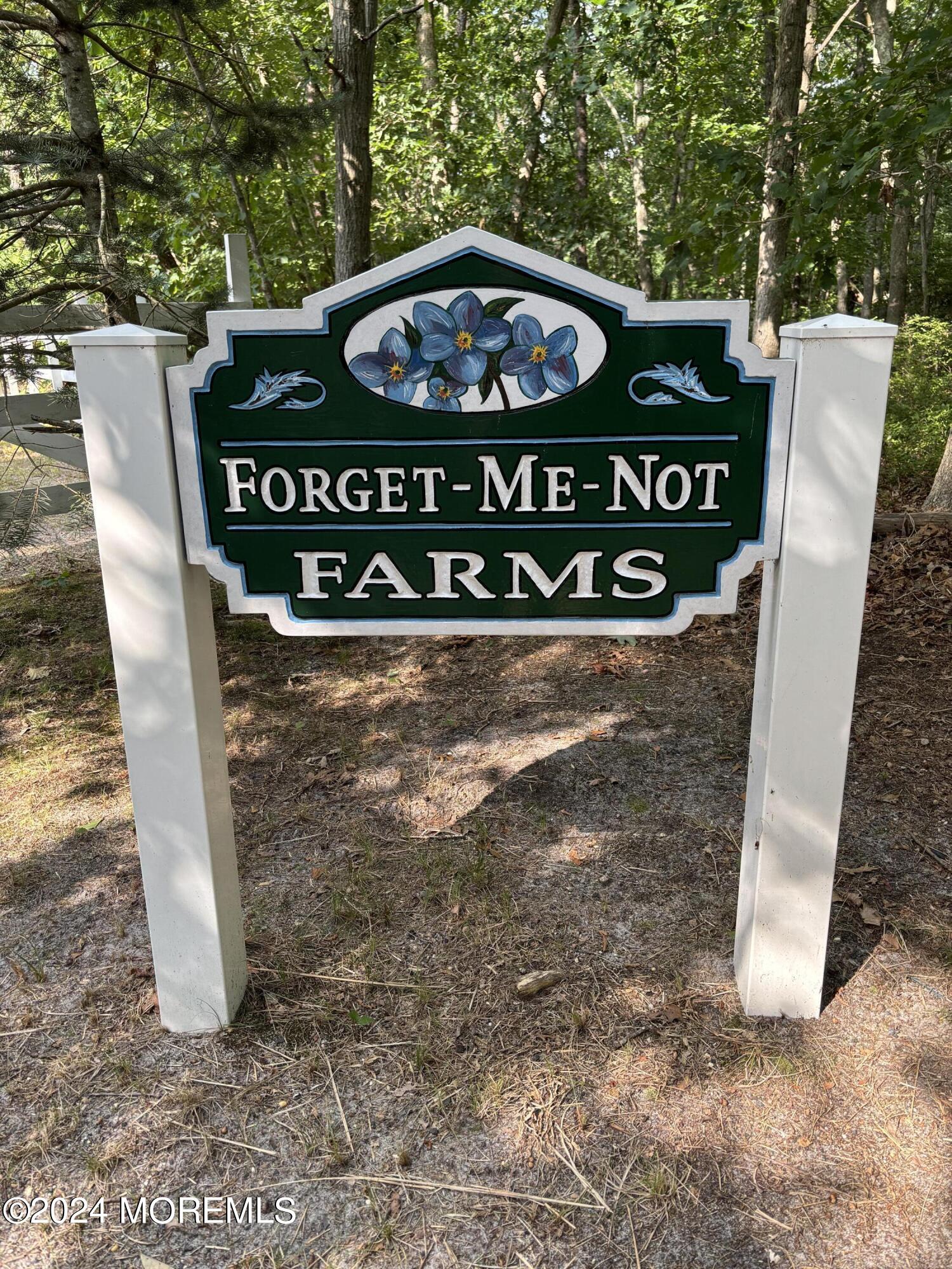 a view of a sign board with yard