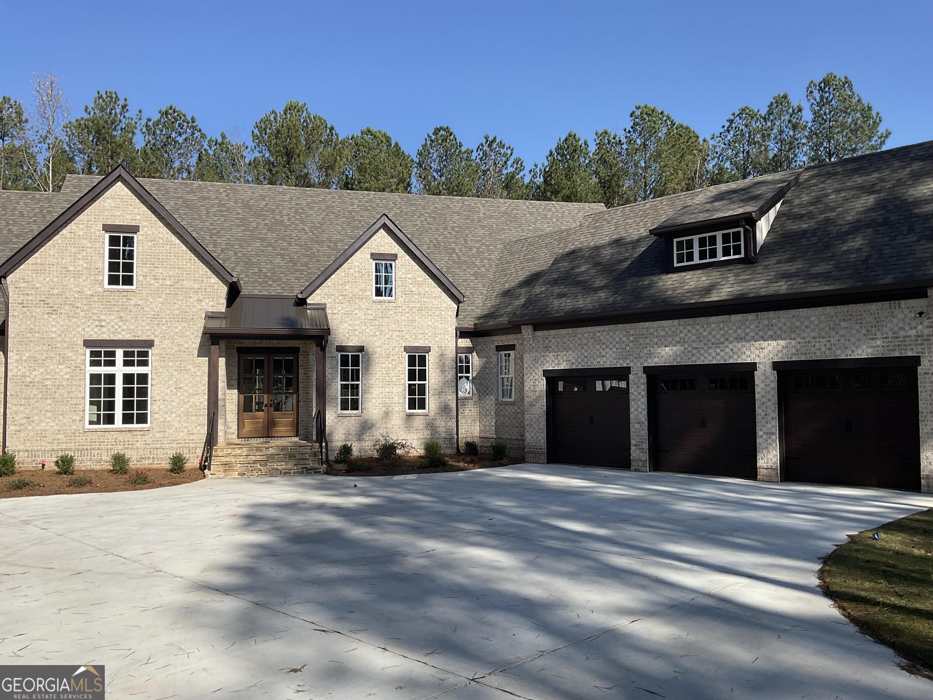 a view of a white house with a outdoor space