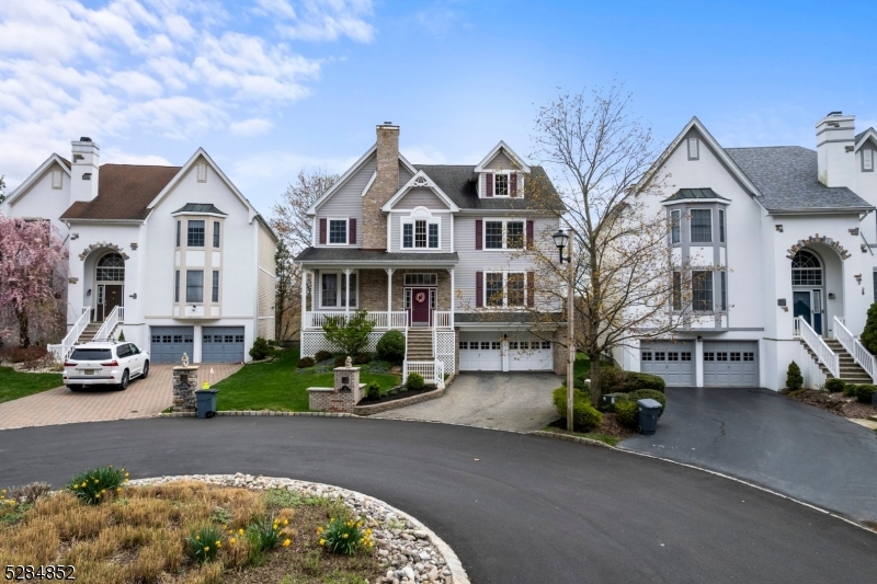 a view of multiple houses with a yard