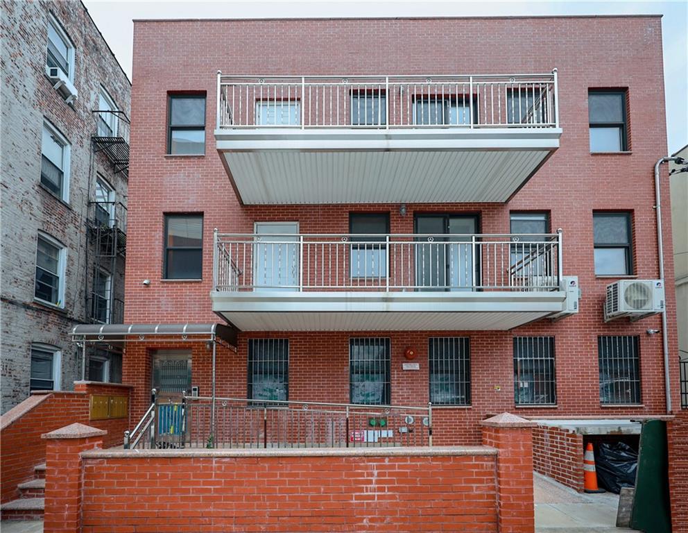 a front view of a building with lots of windows