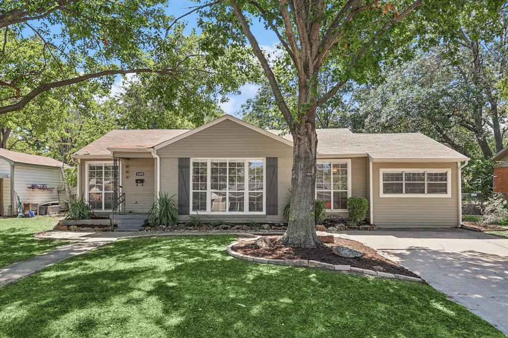 a front view of a house with a yard and porch