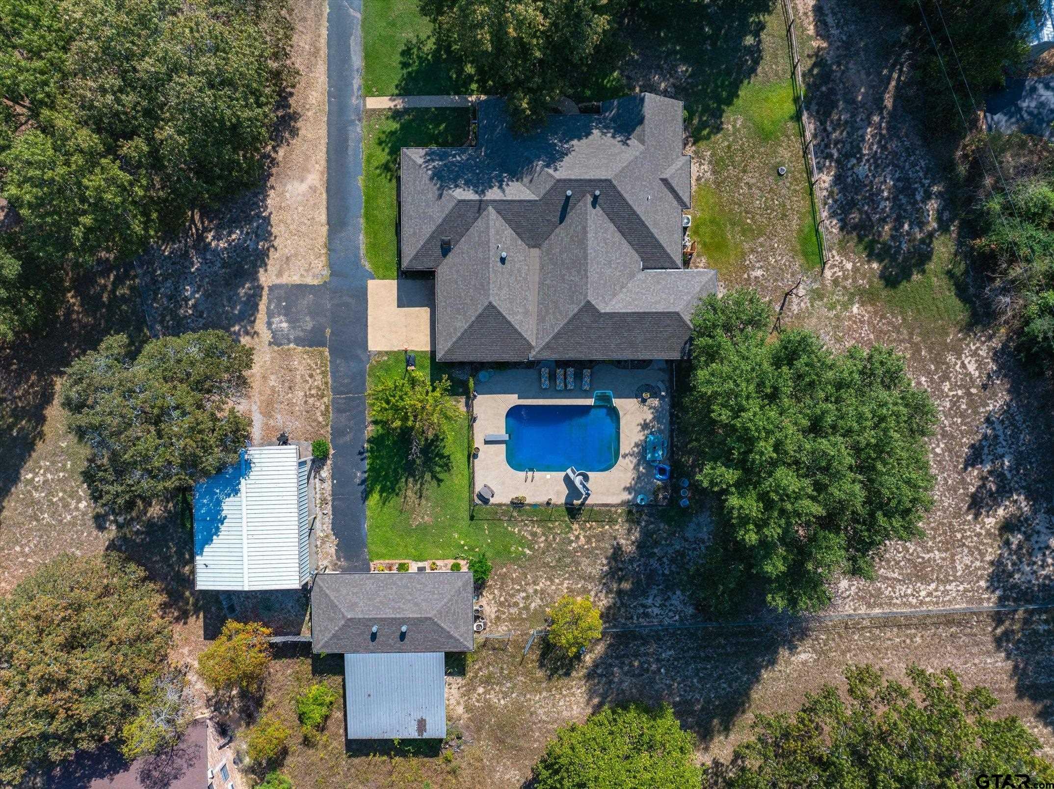 an aerial view of a house with a garden