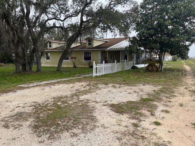 a view of a house with a back yard