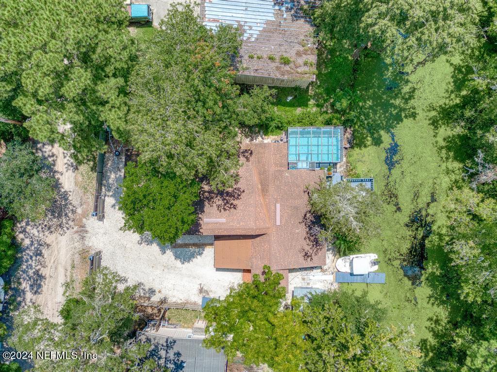 an aerial view of a house with outdoor space