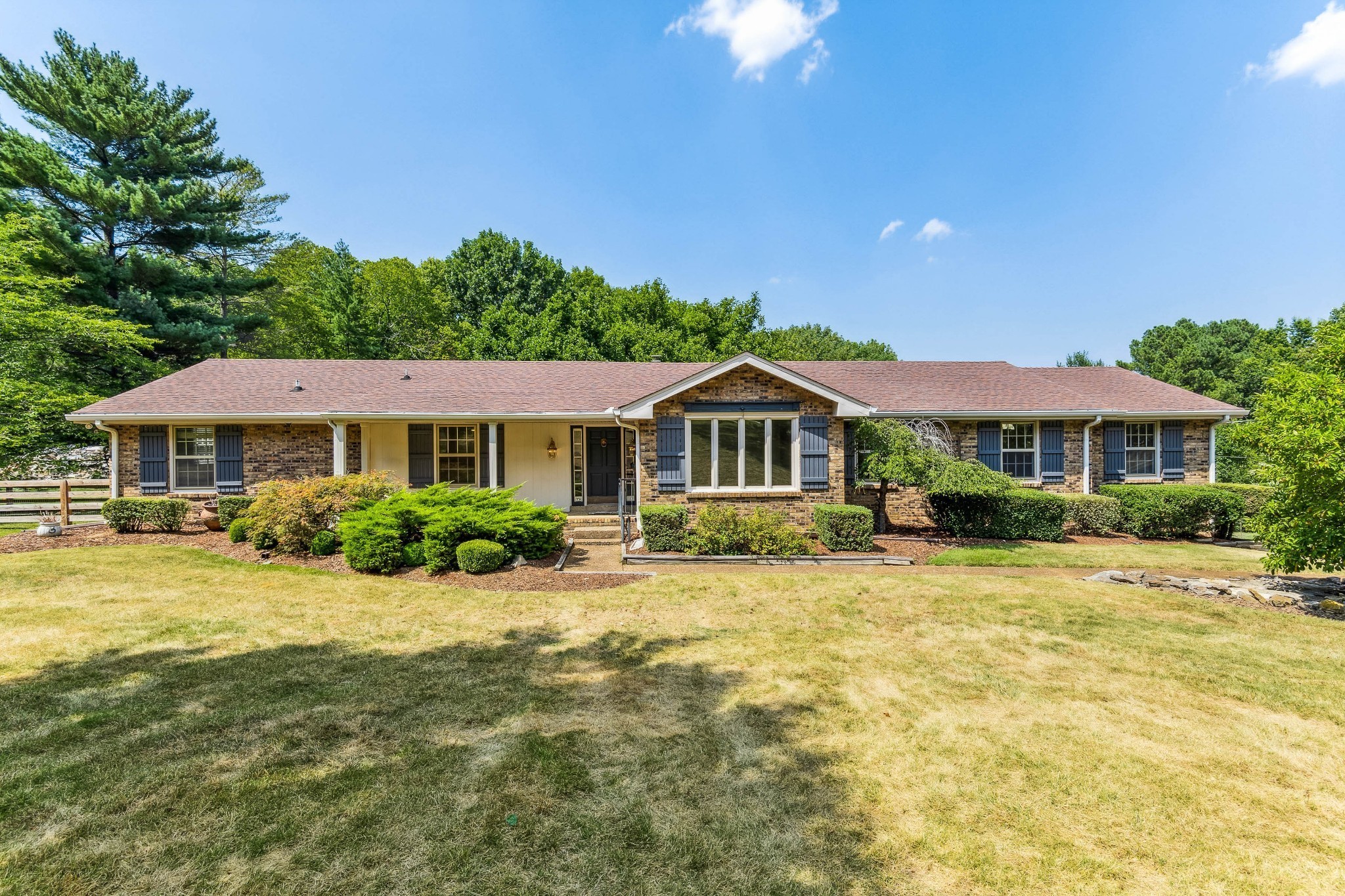 a front view of a house with a yard