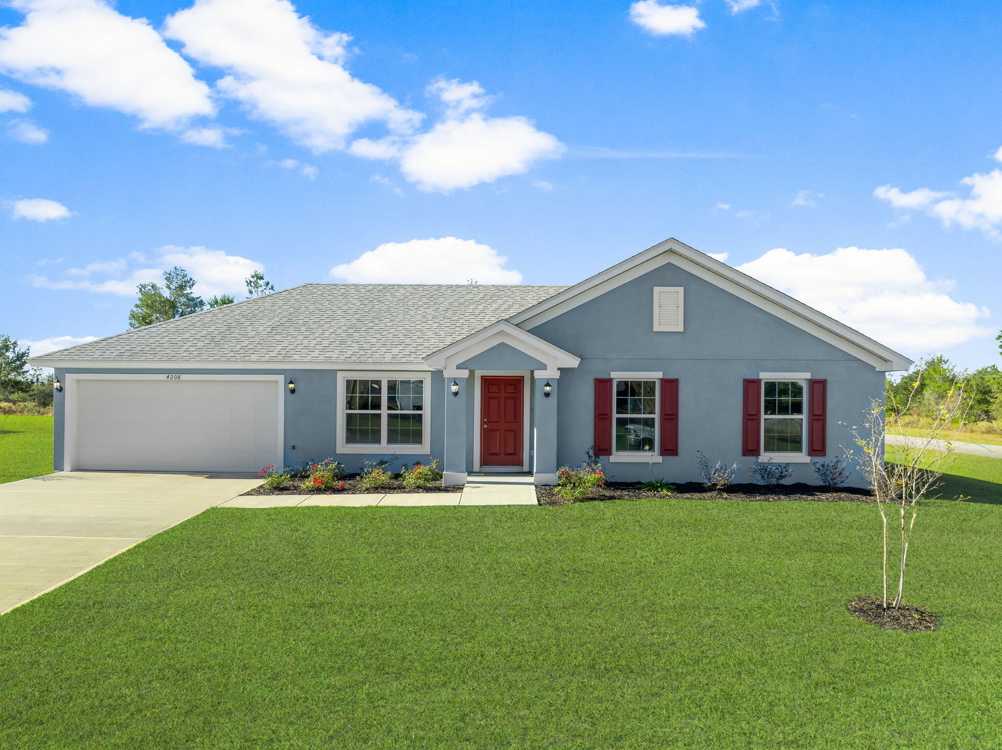 a front view of house with yard and green space