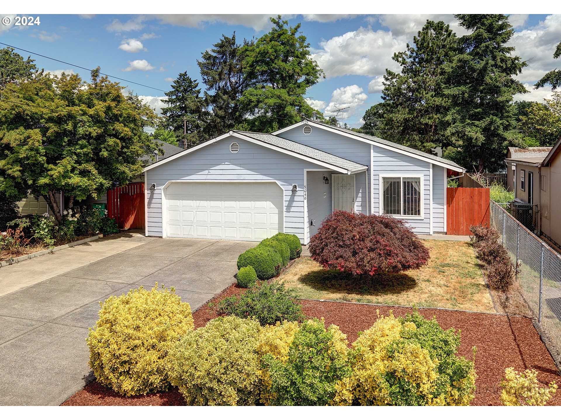 a view of a house with a yard