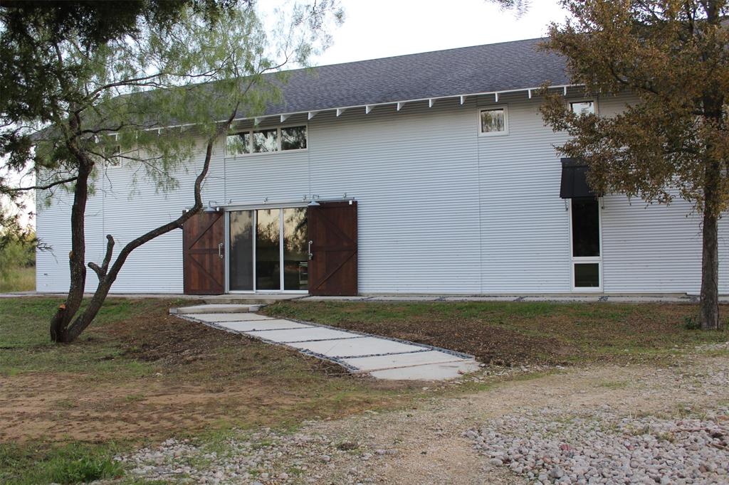 a view of a house with a yard and garage