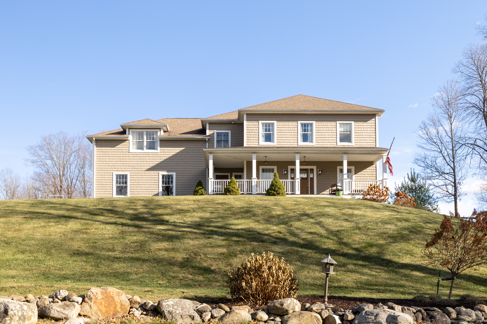 a front view of a house with a yard